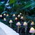 Garden of Eden - Lampă solară LED 12 buc. ciuperci mini alb cald 24 cm x 4 m