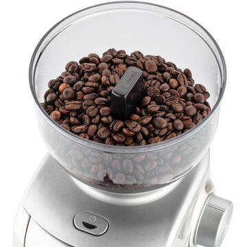 Rasnita ETA Experto Rasnita de cafea integrala din metal cu pietre de macinat conice, finetea de macinare reglabila si recipient pentru cafea macinata.